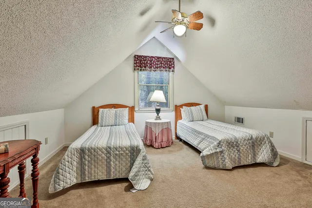 a bedroom with bed and window