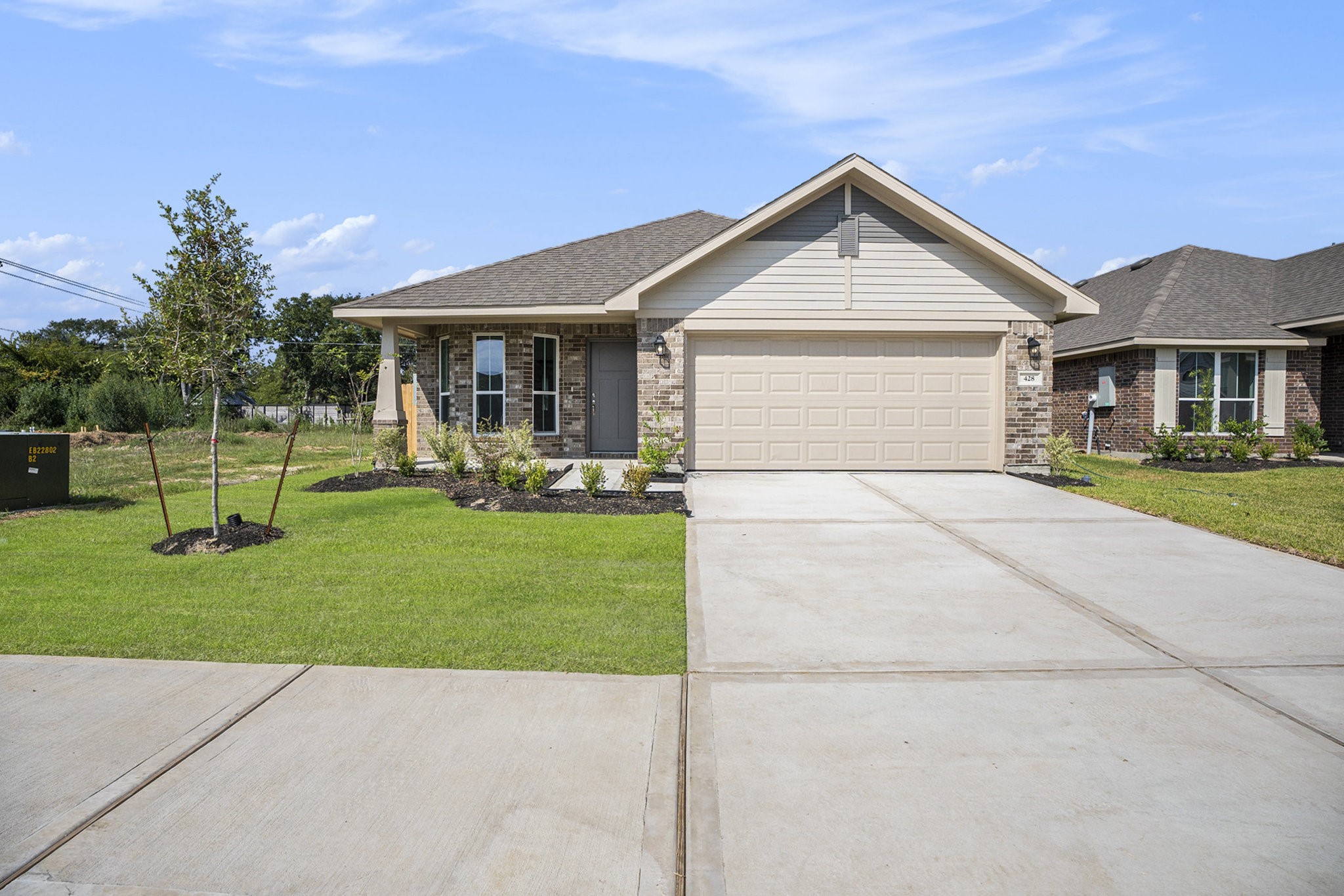 a front view of house with yard and green space