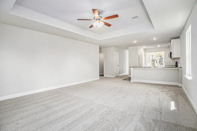 a view of a kitchen with a sink and a stove top oven