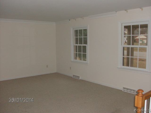 13011 Buckland Road Chester, VA 23831 - Photo 8 of 13 an empty room with windows