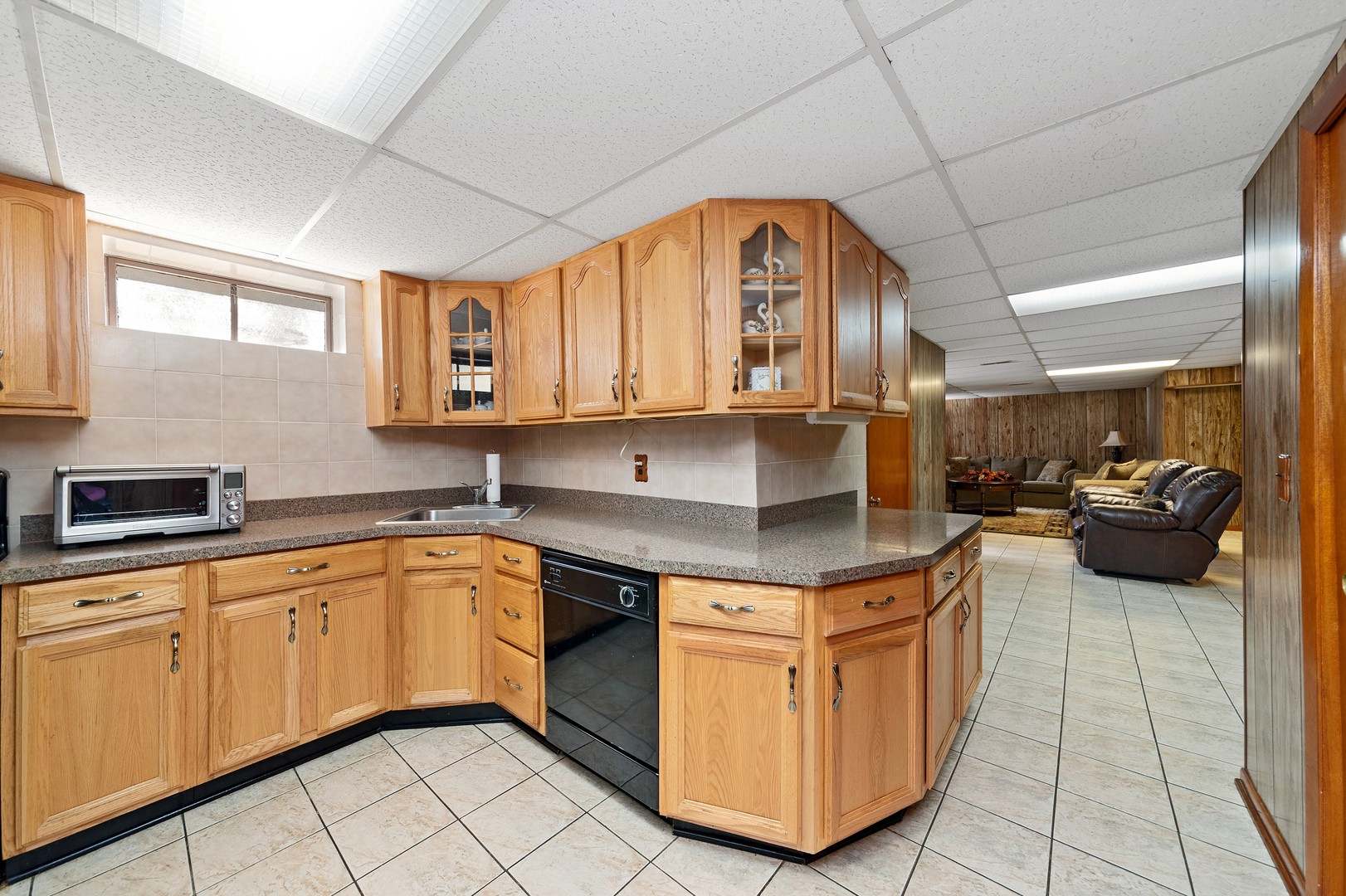 399 Selborne Road Riverside, IL 60546 - Photo 14 of 23 a kitchen with stainless steel appliances granite countertop a stove a sink and a microwave