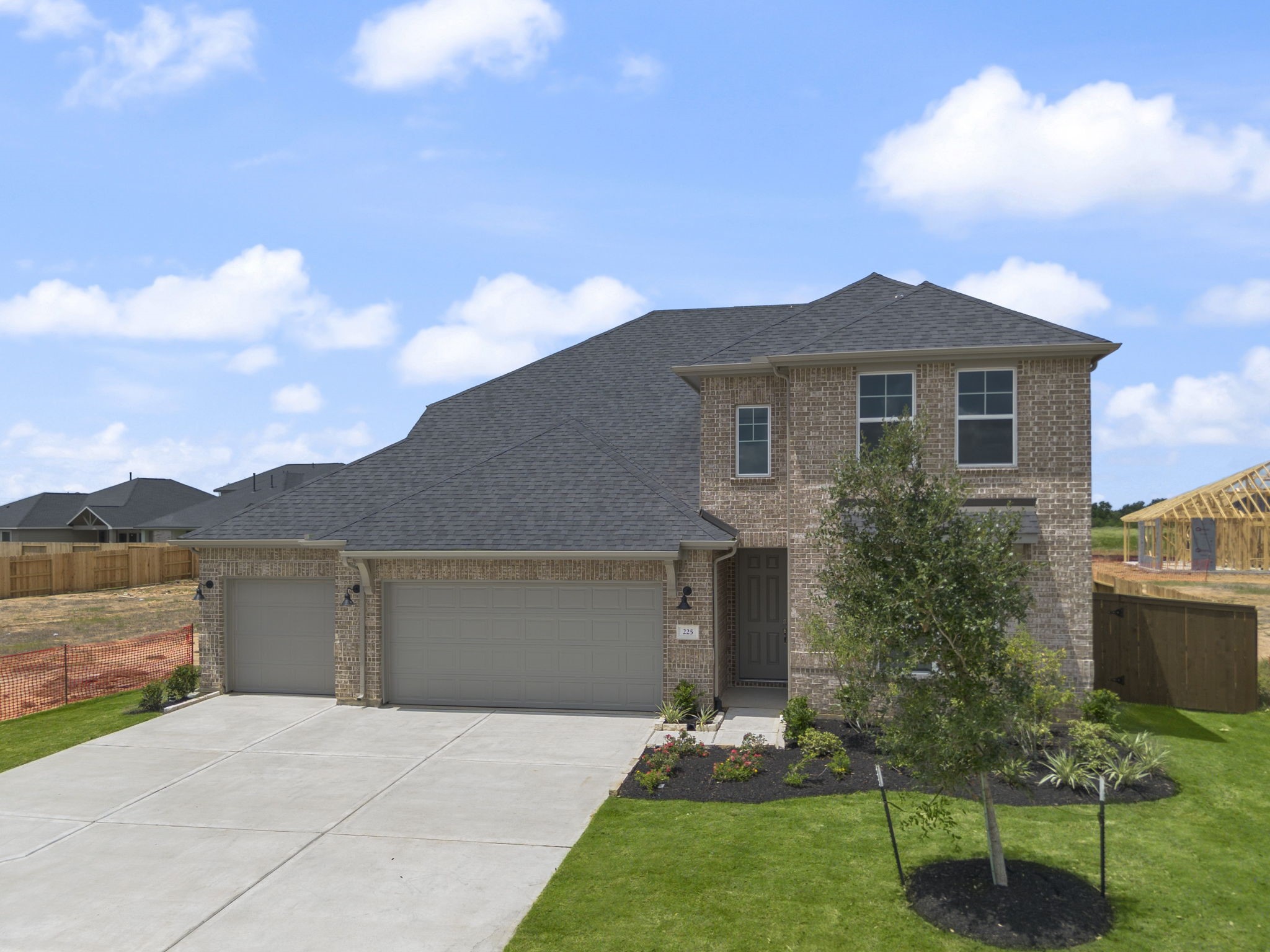 225 Sandhill Grv Trail Hempstead, TX 77445 - Photo 22 of 28 a front view of a house with a garden and yard