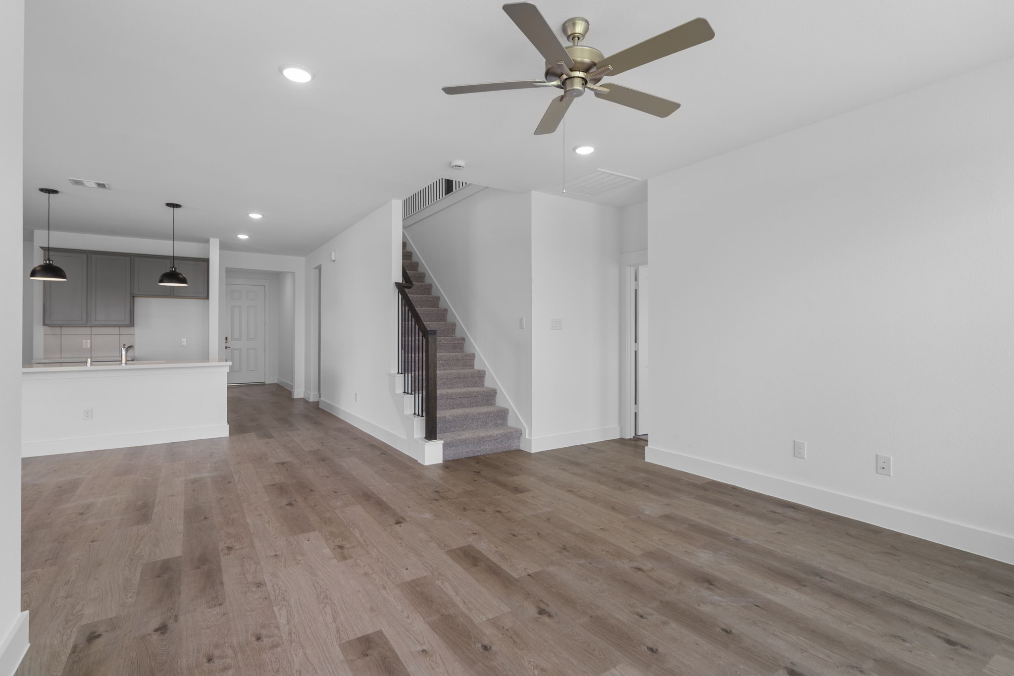 225 Sandhill Grv Trail Hempstead, TX 77445 - Photo 6 of 28 wooden floor in an empty room with a window