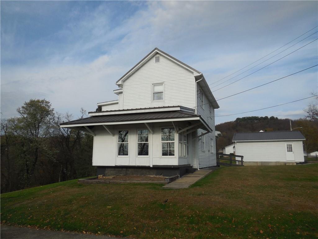 316 Highland Road Rochester, PA 15074 - Photo 1 of 31 a view of a house with a yard