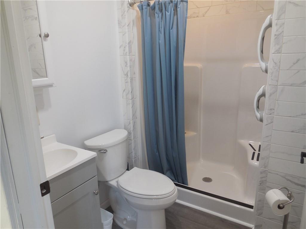 316 Highland Road Rochester, PA 15074 - Photo 15 of 31 a bathroom with a sink and a toilet