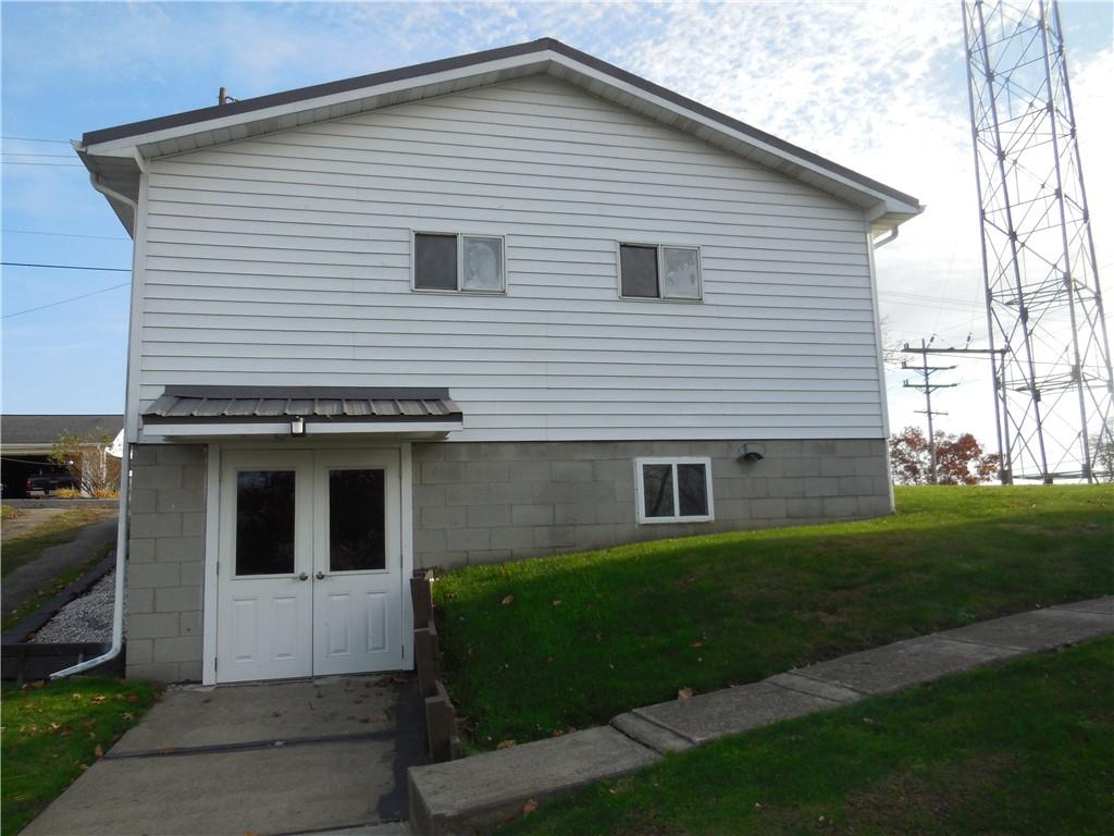 316 Highland Road Rochester, PA 15074 - Photo 6 of 31 a front view of a house with a yard