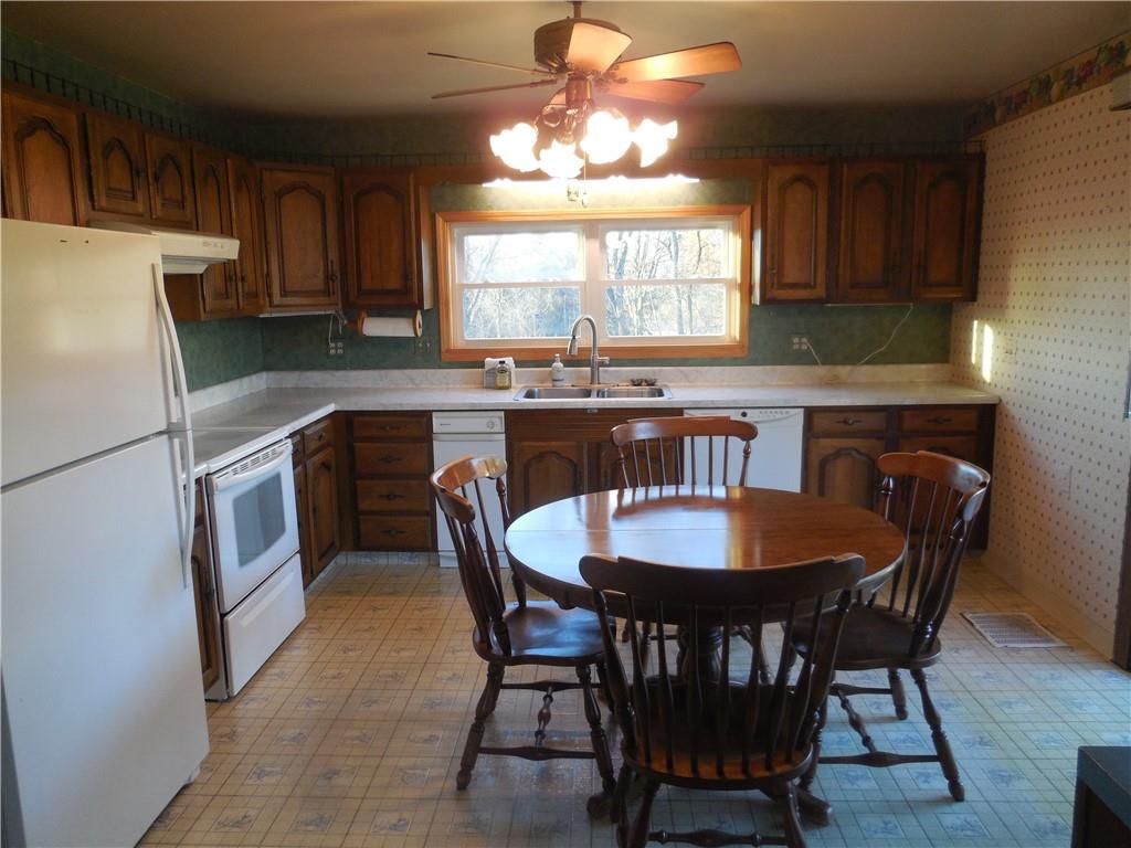 316 Highland Road Rochester, PA 15074 - Photo 9 of 31 a dining table with chairs and window