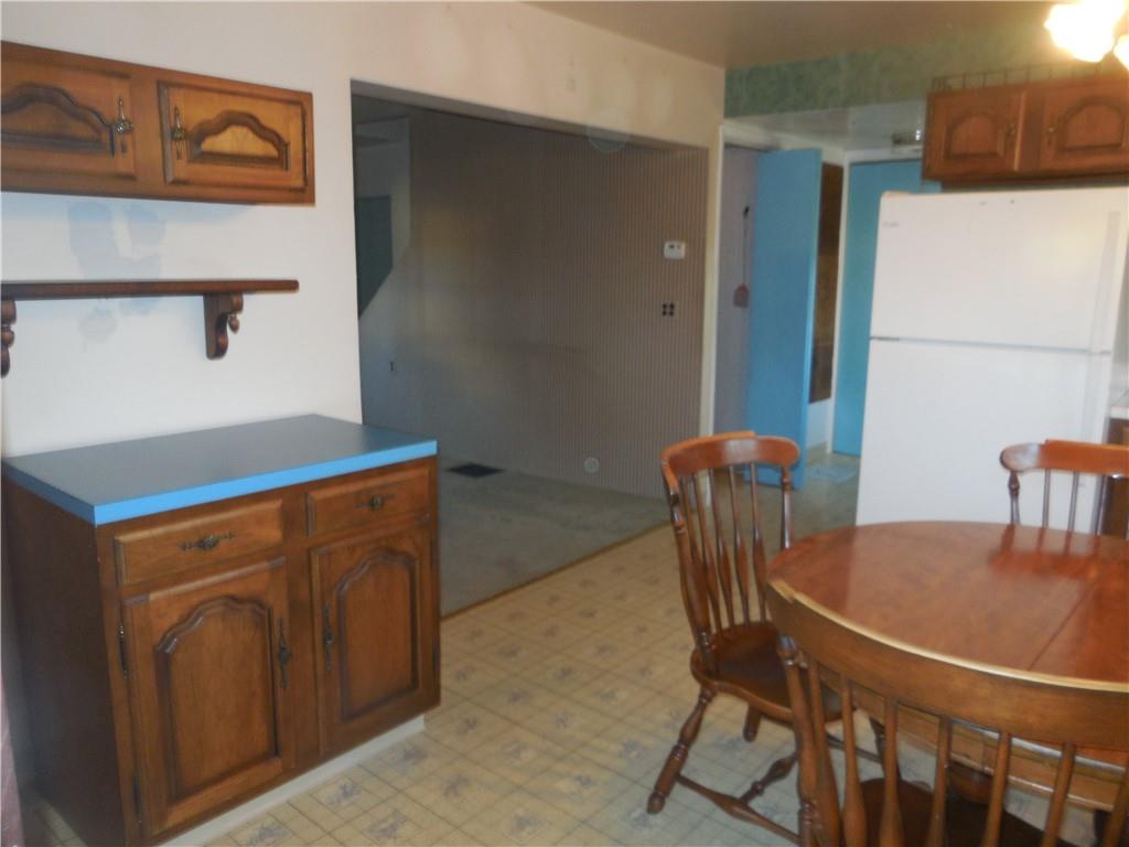 316 Highland Road Rochester, PA 15074 - Photo 10 of 31 a dining room with furniture and wooden floor