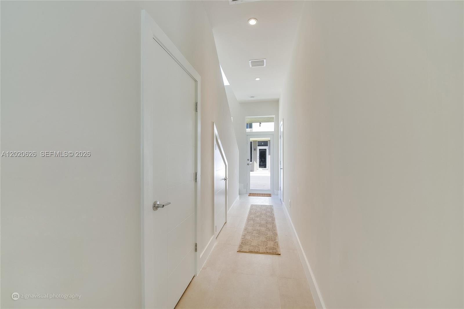 7701 Southwest 95th Terrace, Unit 1 Miami, FL 33156 - Photo 9 of 18 a view of a hallway with a white walls