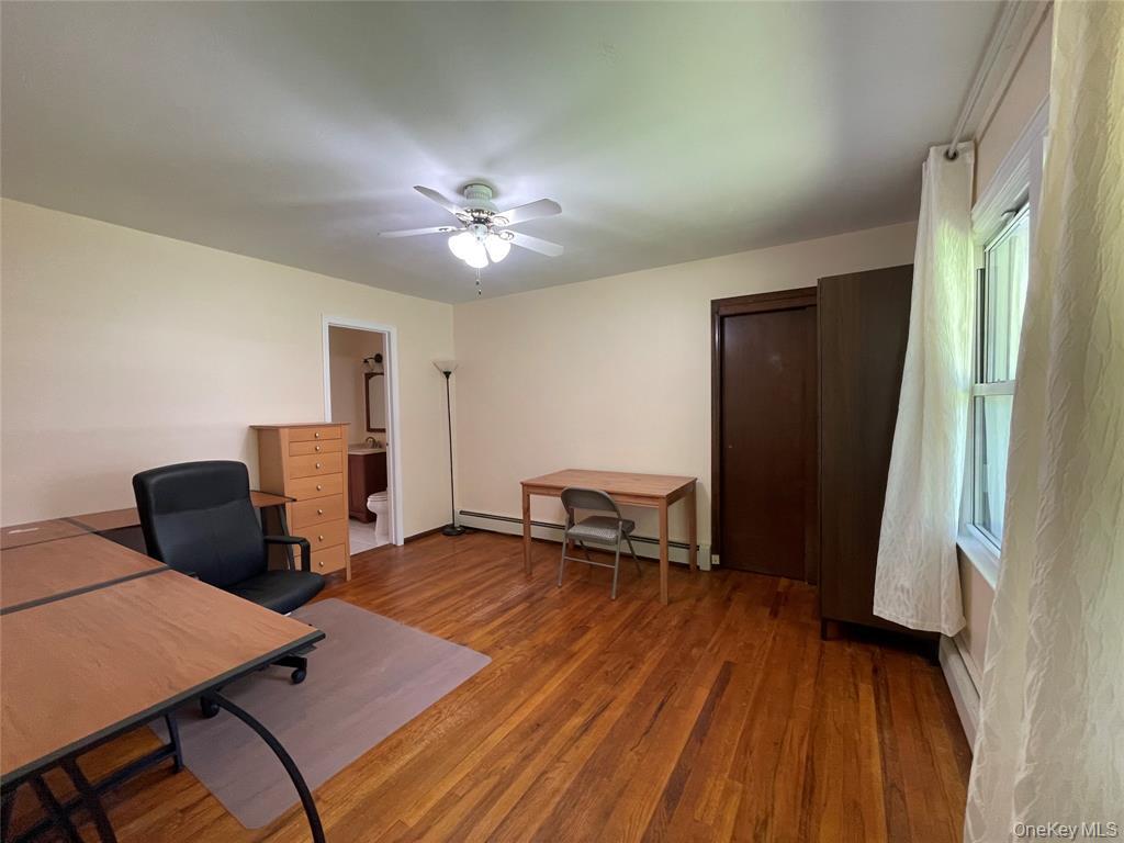 4 Cornwallis Road East Setauket, NY 11733 - Photo 7 of 16 a view of a livingroom with furniture and a chair