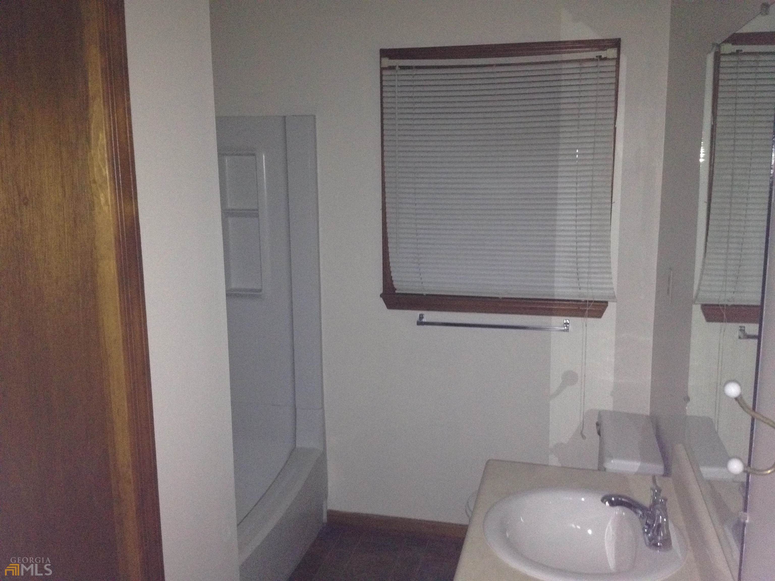 103 Appleton Boulevard Stockbridge, GA 30281 - Photo 15 of 31 a bathroom with a sink a toilet and shower