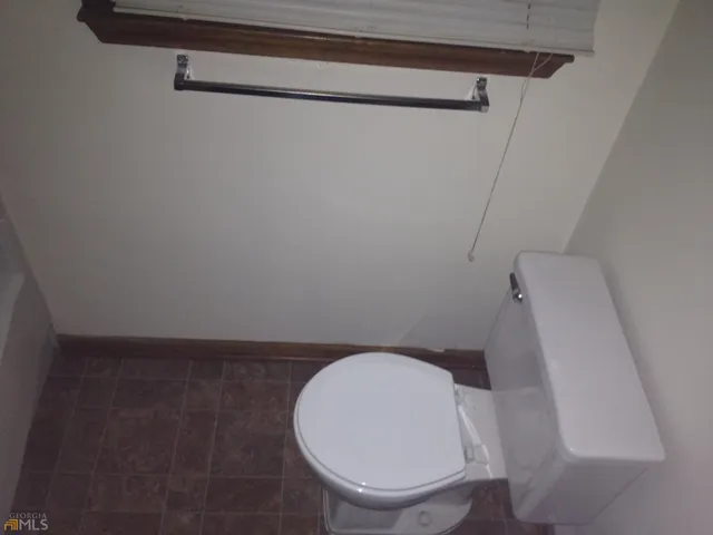 a bathroom with a toilet and a sink