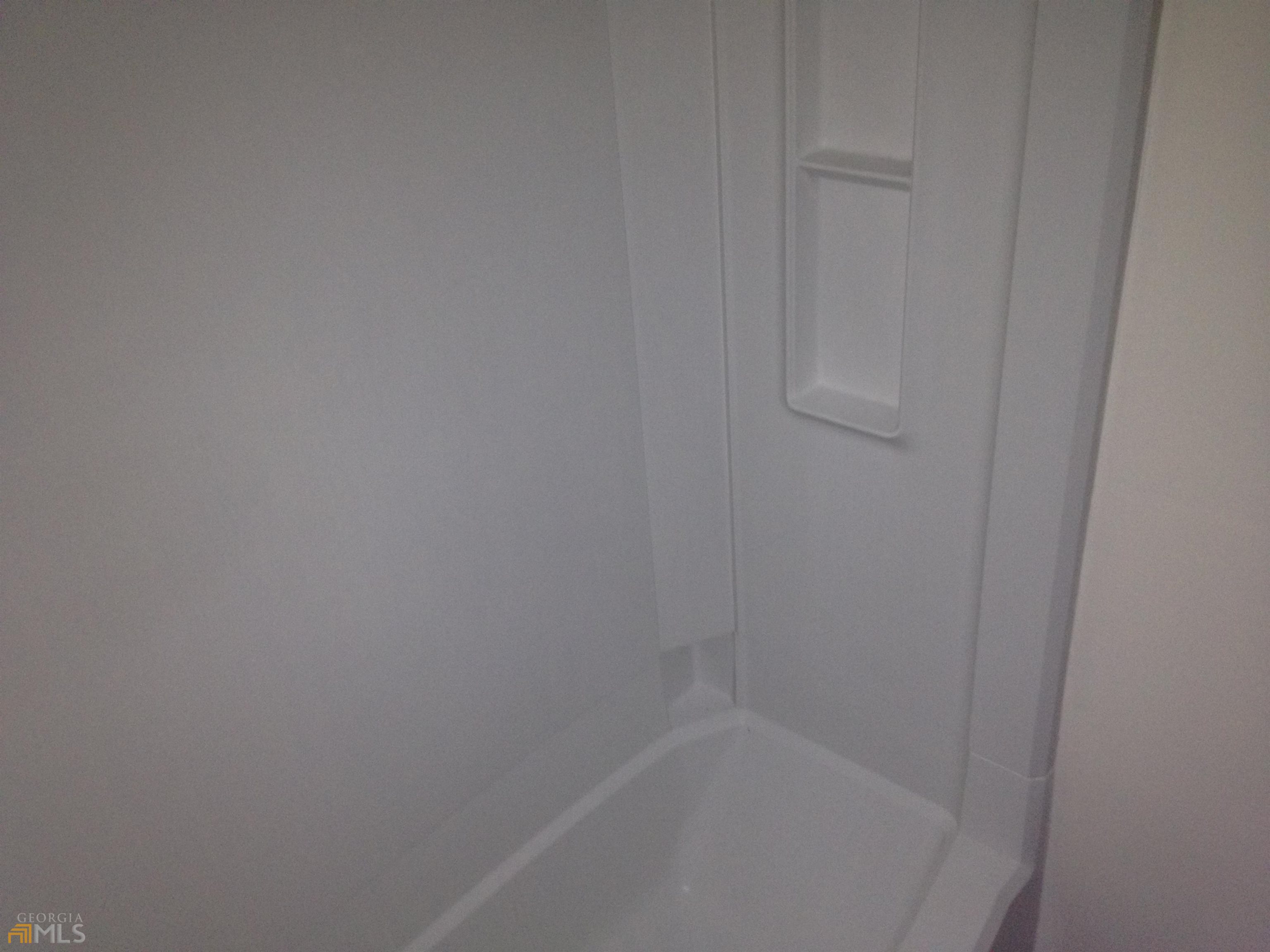 103 Appleton Boulevard Stockbridge, GA 30281 - Photo 29 of 31 a close up view of a bathtub