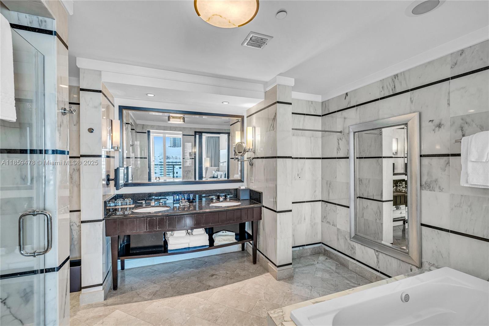 4391 Collins Avenue, Unit 1706/1707 Miami Beach, FL 33140 - Photo 16 of 50 a kitchen with stainless steel appliances granite countertop a refrigerator and a stove
