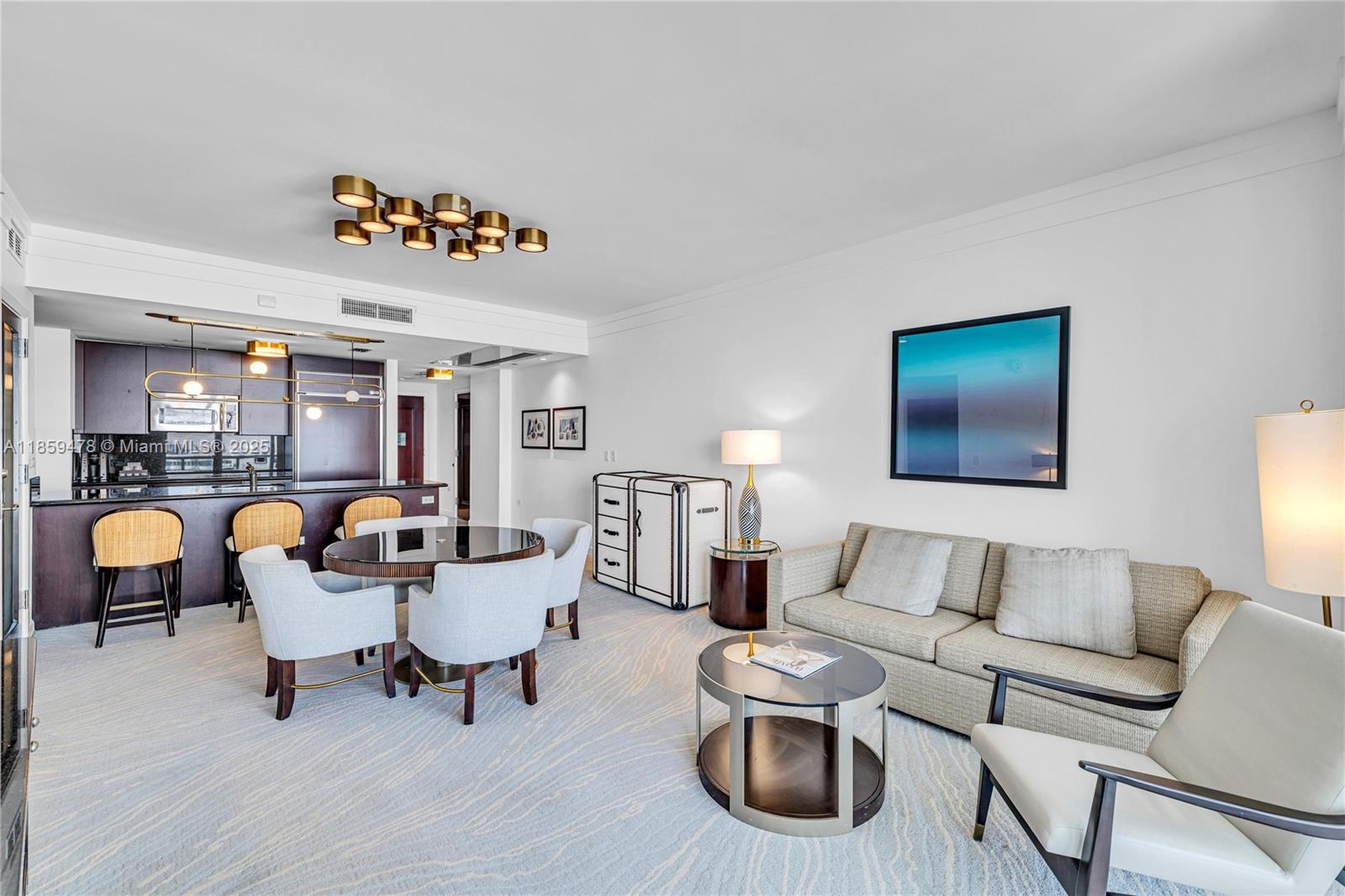 4391 Collins Avenue, Unit 1706/1707 Miami Beach, FL 33140 - Photo 25 of 50 a living room with furniture and a table