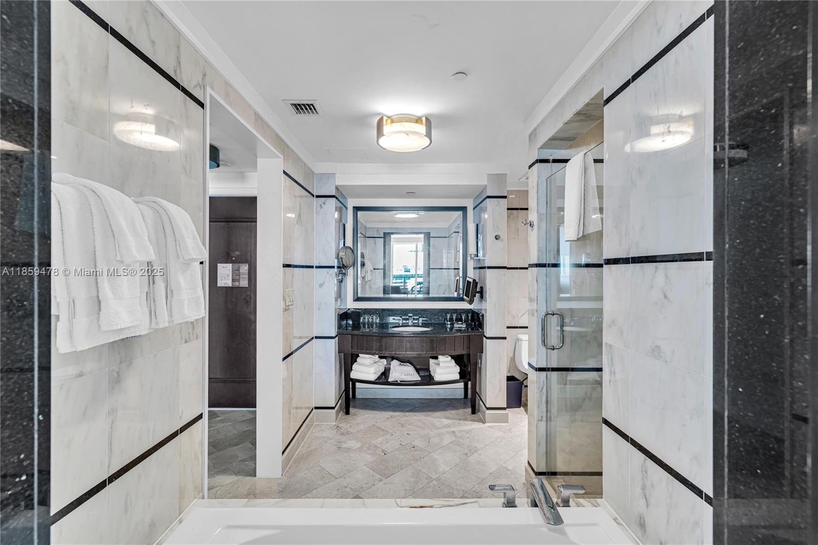 4391 Collins Avenue, Unit 1706/1707 Miami Beach, FL 33140 - Photo 33 of 50 a living room with furniture and a refrigerator