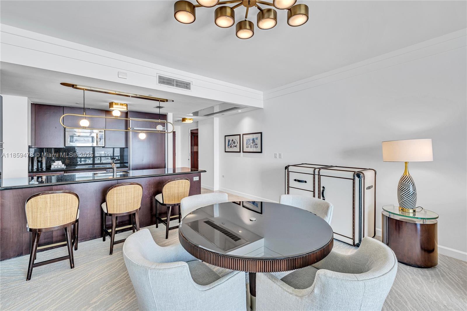 4391 Collins Avenue, Unit 1706/1707 Miami Beach, FL 33140 - Photo 44 of 50 a living room with furniture and a lamp