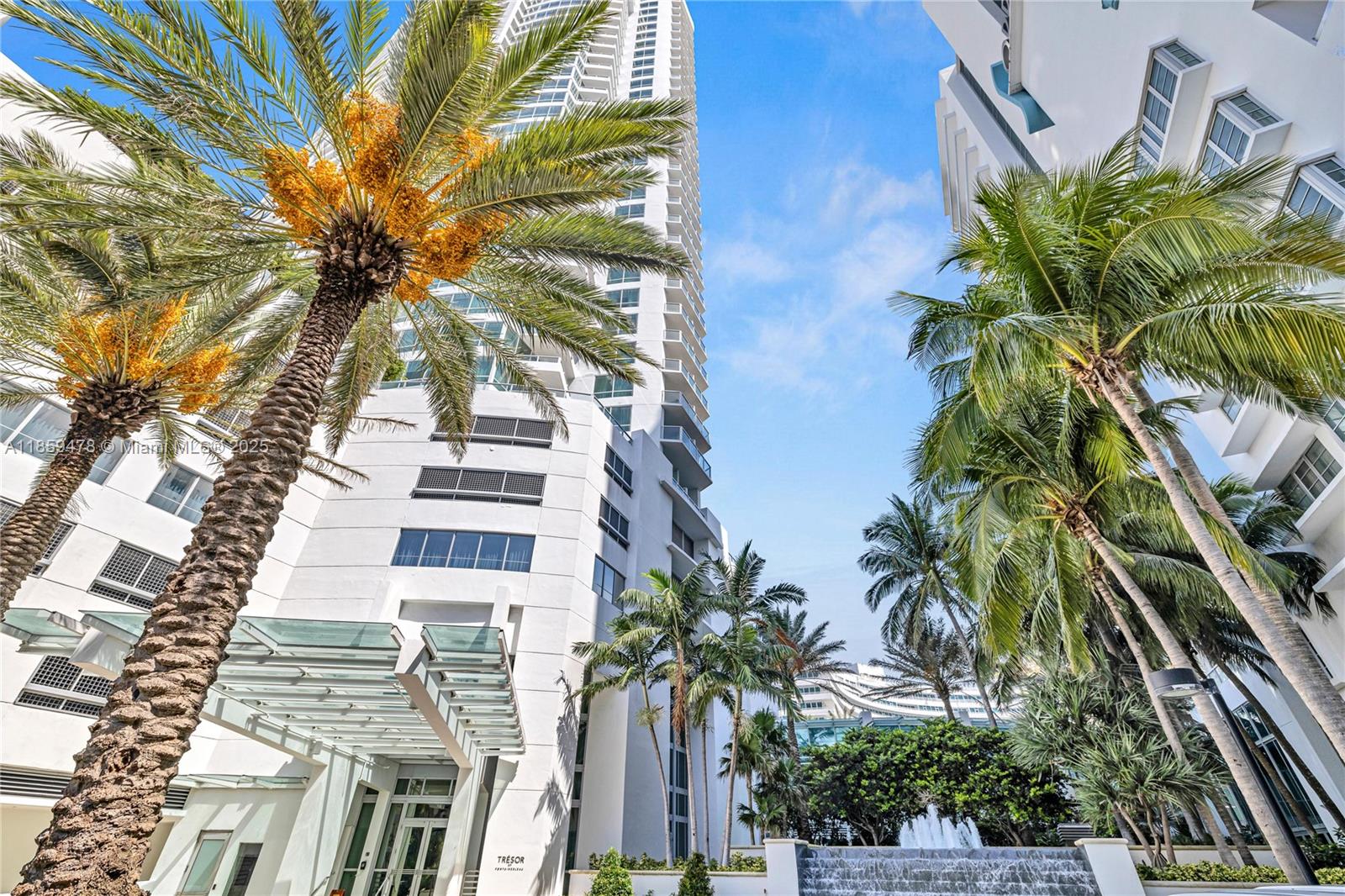 4391 Collins Avenue, Unit 1706/1707 Miami Beach, FL 33140 - Photo 50 of 50 a view of a palm trees in front of a building