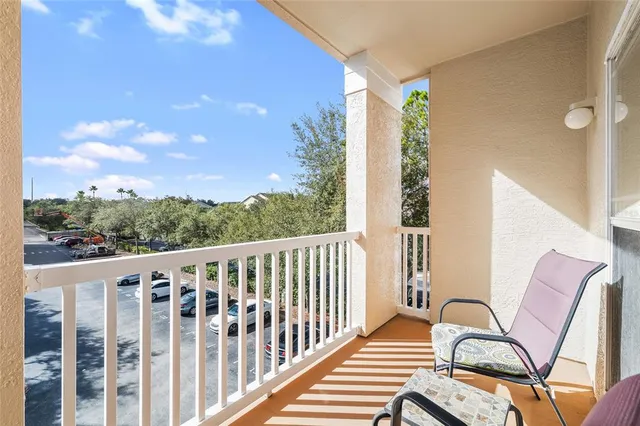 a view of a balcony with wooden floor