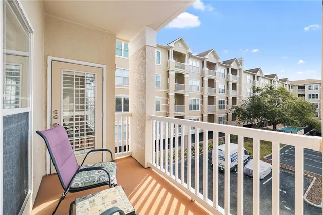 a view of a balcony with chairs