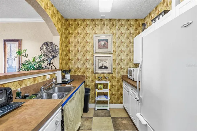 a view of a hallway with wooden floor and windows