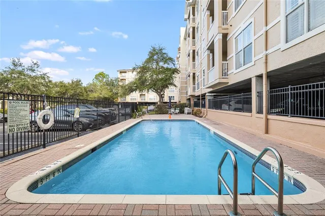 a view of a swimming pool with a lounge chair