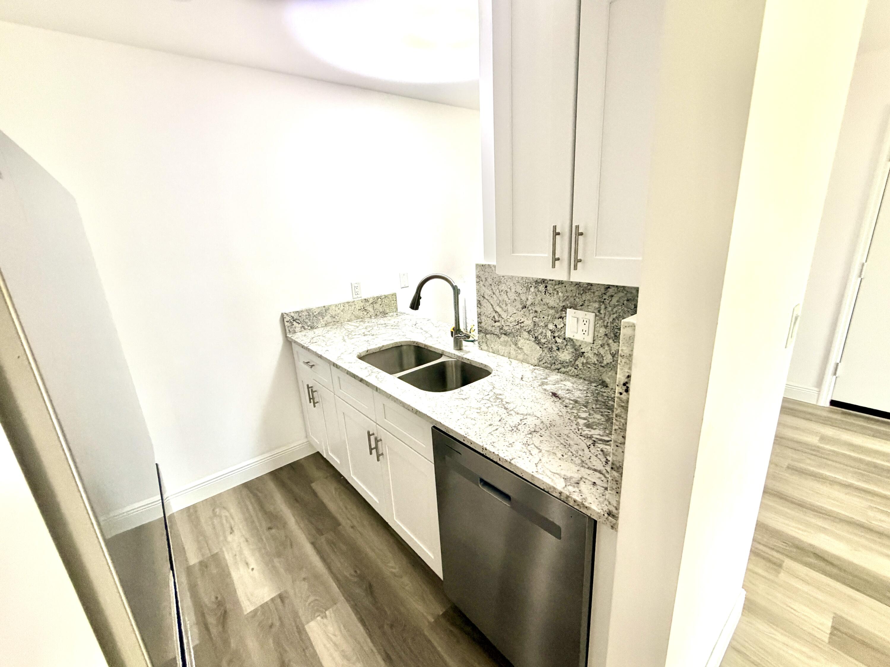 1766 Abbey Road, Unit 105 West Palm Beach, FL 33415 - Photo 4 of 8 ___F105 kitchen 3