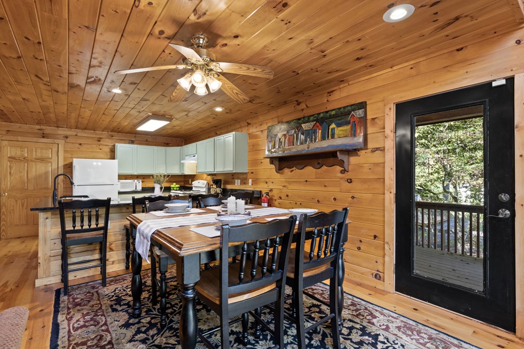 96 Holiday Court Ellijay, GA 30540 - Photo 15 of 51 a view of a dining room with furniture window and wooden floor