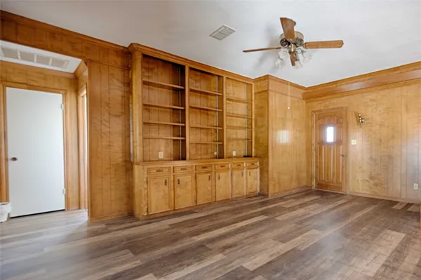 a bedroom with a bed window and a table