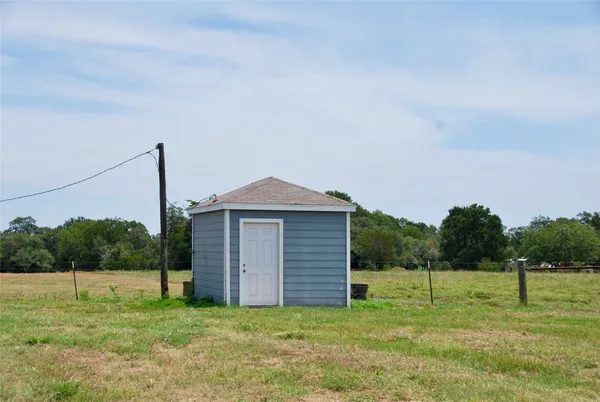 an aerial view of a house having yard