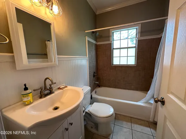a bathroom with a sink a toilet and a bathtub