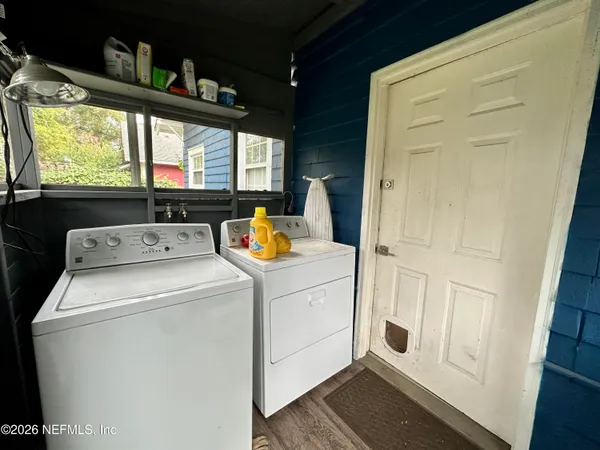 a utility room with dryer and washer