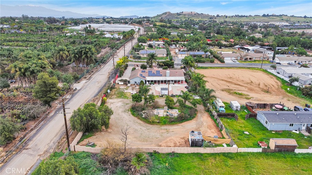 17777 Brazier Drive Riverside, CA 92508 - Photo 48 of 55 an aerial view of a house with a garden and lake view