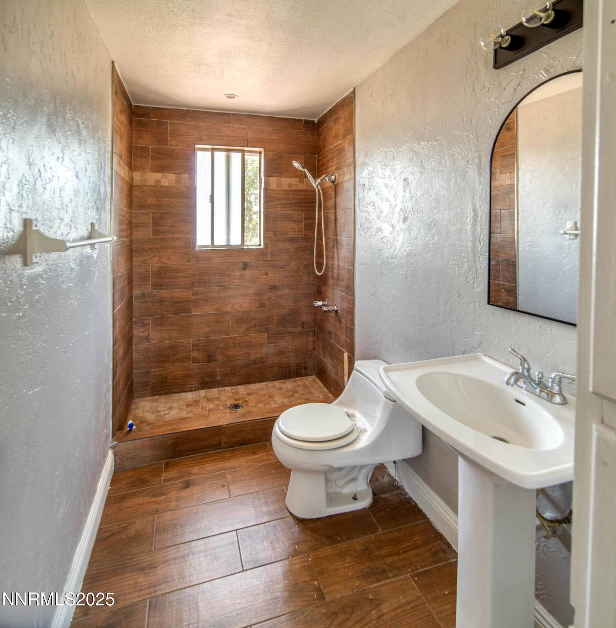11590 Tupelo Street Reno, NV 89506 - Photo 13 of 19 a bathroom with a sink a toilet and shower