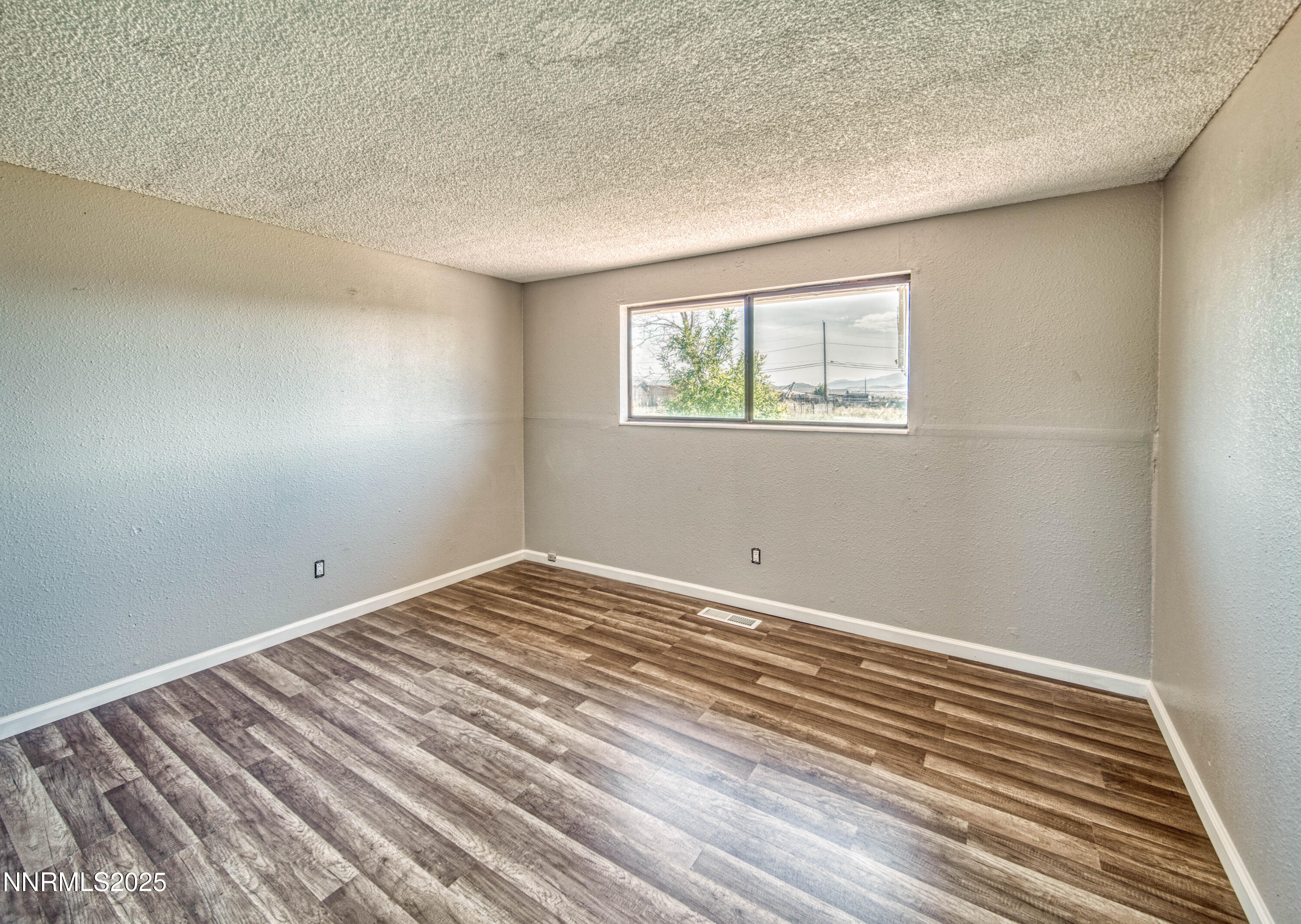 11590 Tupelo Street Reno, NV 89506 - Photo 14 of 19 a view of a room with wooden floor and closet