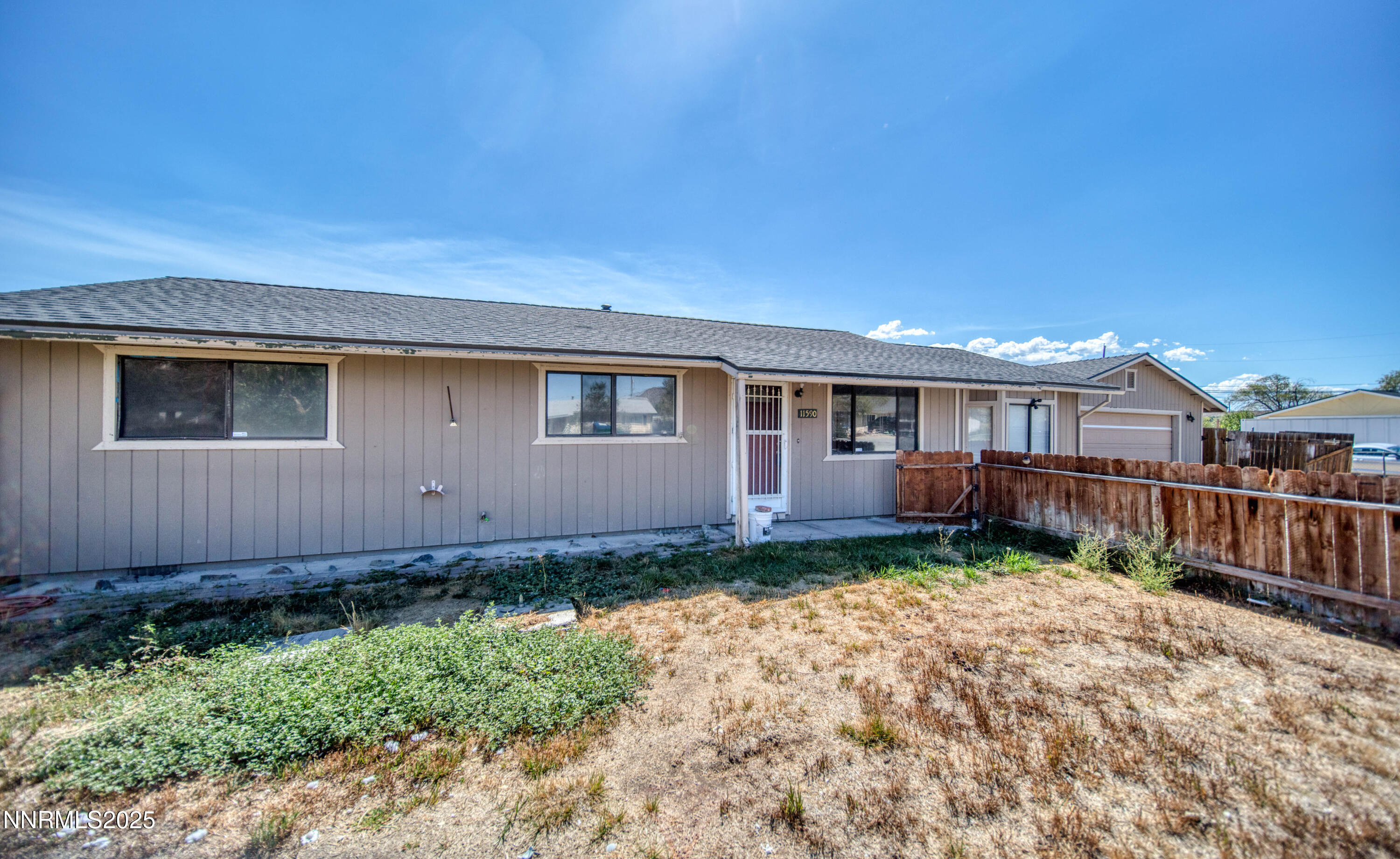 11590 Tupelo Street Reno, NV 89506 - Photo 19 of 19 a front view of a house with garden