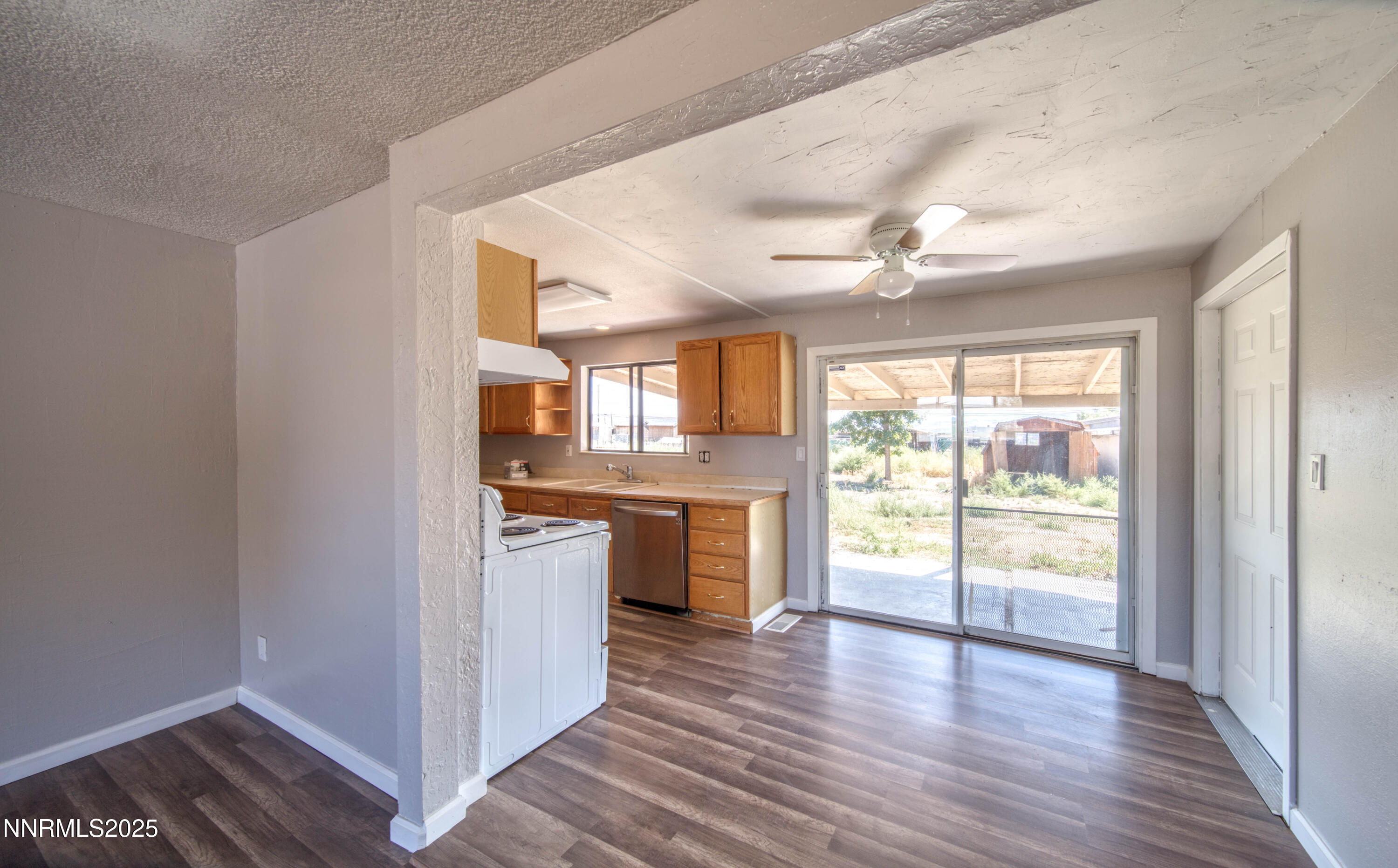 11590 Tupelo Street Reno, NV 89506 - Photo 10 of 19 a view of a kitchen with a stove top oven