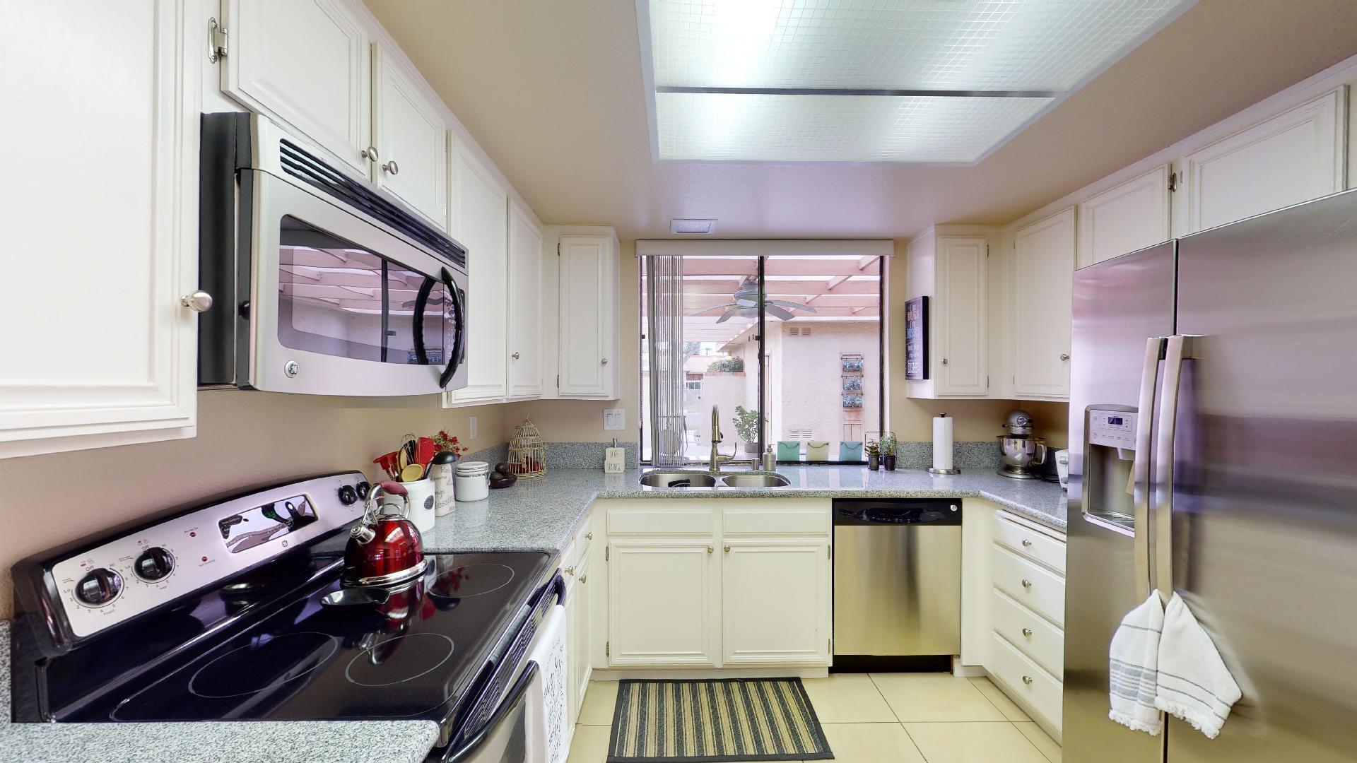 24 Granada Drive Rancho Mirage, CA 92270 - Photo 12 of 36 a kitchen with a sink stove and cabinets
