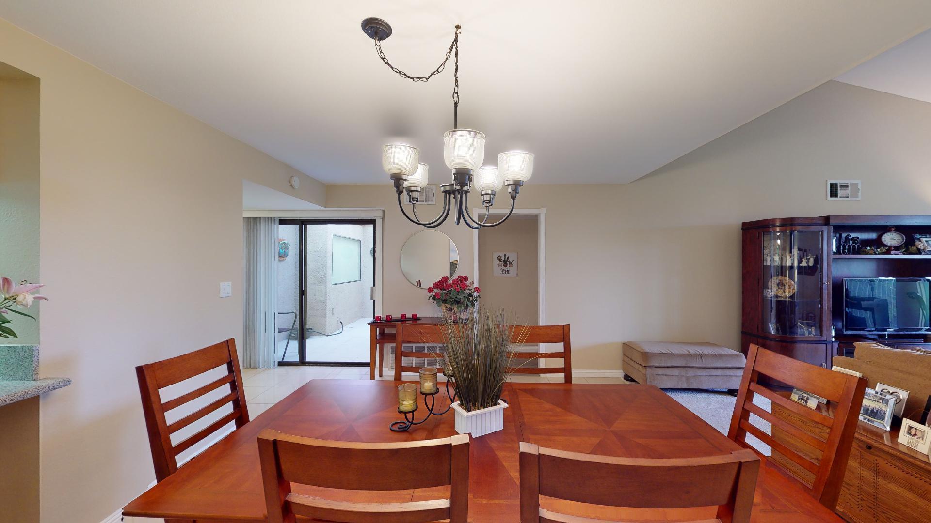 24 Granada Drive Rancho Mirage, CA 92270 - Photo 16 of 36 a view of a dining room with furniture and wooden floor