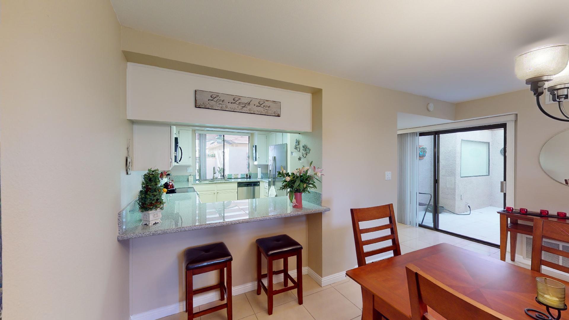 24 Granada Drive Rancho Mirage, CA 92270 - Photo 17 of 36 a view of a dining room with furniture