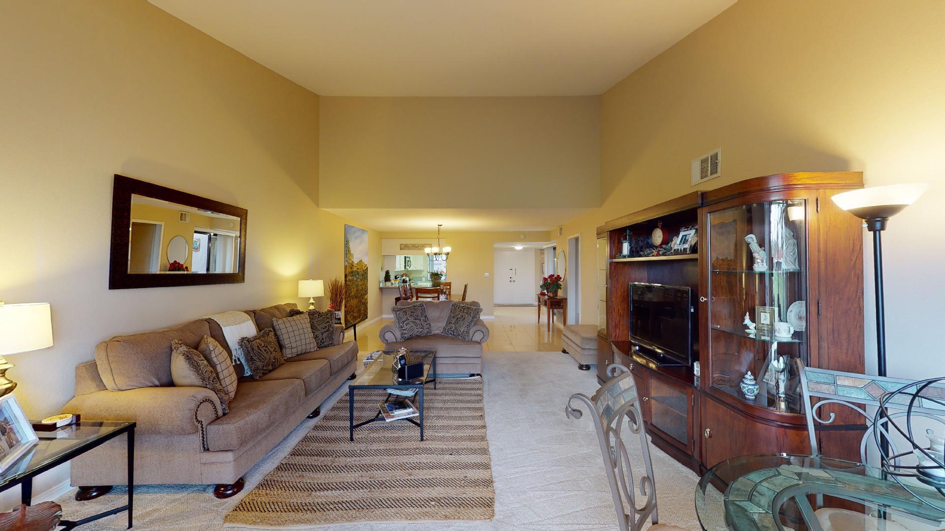 24 Granada Drive Rancho Mirage, CA 92270 - Photo 21 of 36 a living room with furniture and a flat screen tv