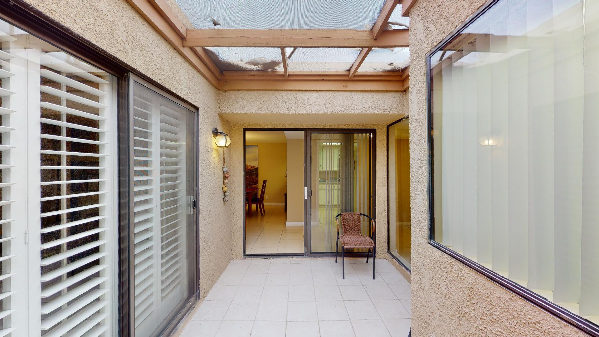 24 Granada Drive Rancho Mirage, CA 92270 - Photo 24 of 36 a view of a hallway with wooden shelves and door