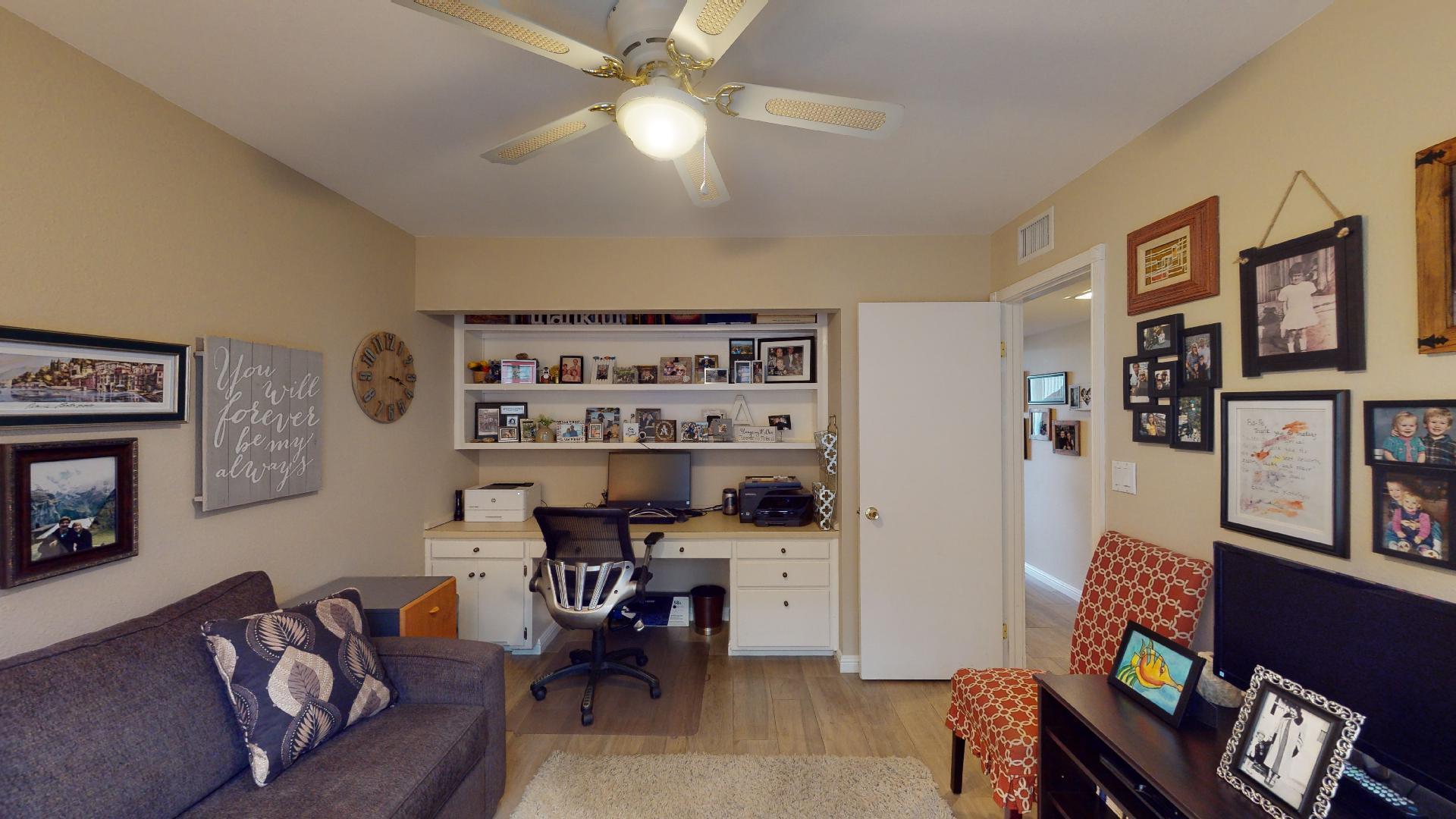 24 Granada Drive Rancho Mirage, CA 92270 - Photo 26 of 36 a living room with furniture a rug and a wall painting