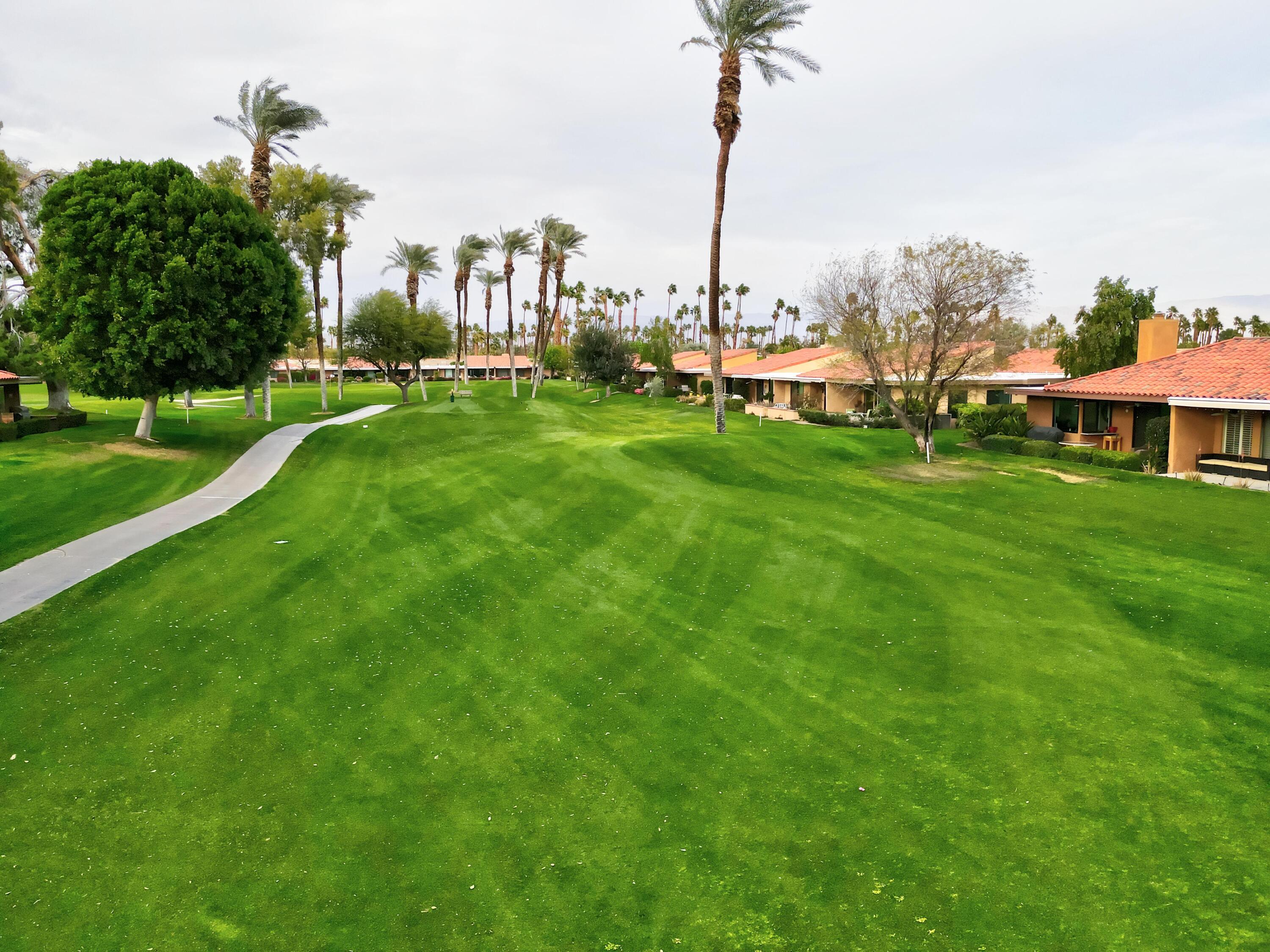 24 Granada Drive Rancho Mirage, CA 92270 - Photo 35 of 36 a view of a city with tall buildings and a big yard