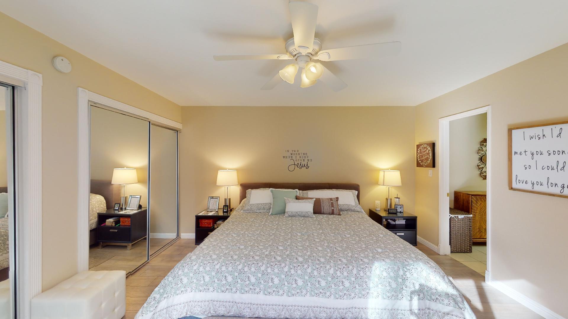 24 Granada Drive Rancho Mirage, CA 92270 - Photo 5 of 36 a spacious bedroom with a bed and a mirror