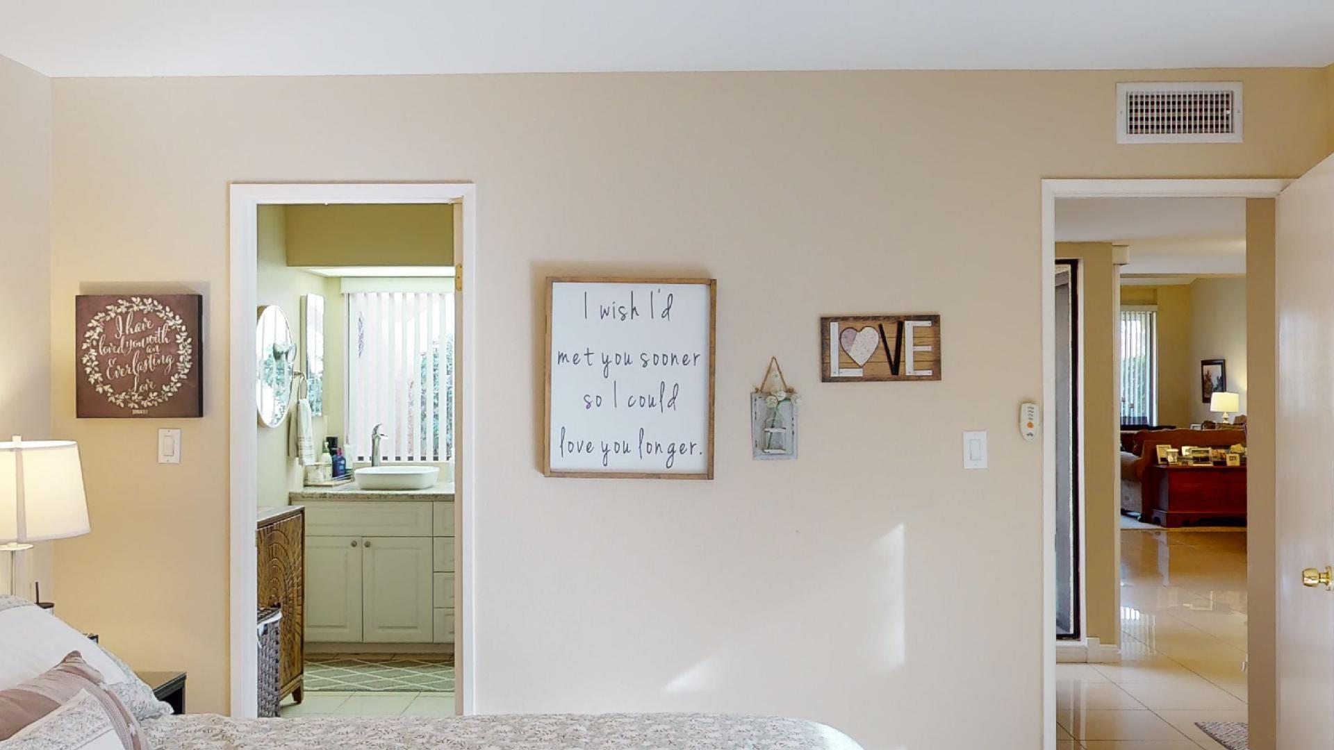 24 Granada Drive Rancho Mirage, CA 92270 - Photo 7 of 36 a view of a hallway with paintings on the wall