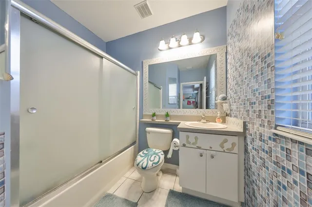 a bed room with a bed and a window