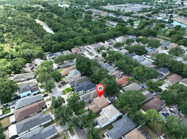 an aerial view of residential building with outdoor space and lake view