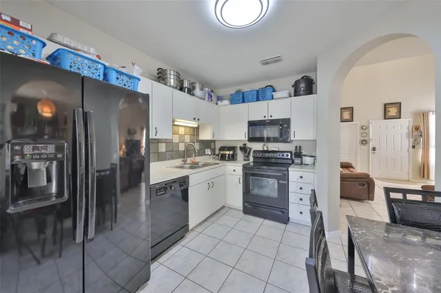 a dining room with furniture and a window