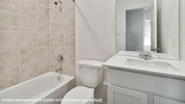 a bathroom with a sink a toilet and bathtub